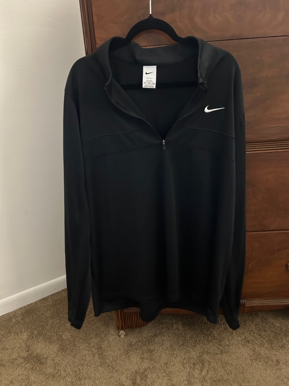 Nike Black Dri-FIT quarter zip with White Tag Detail